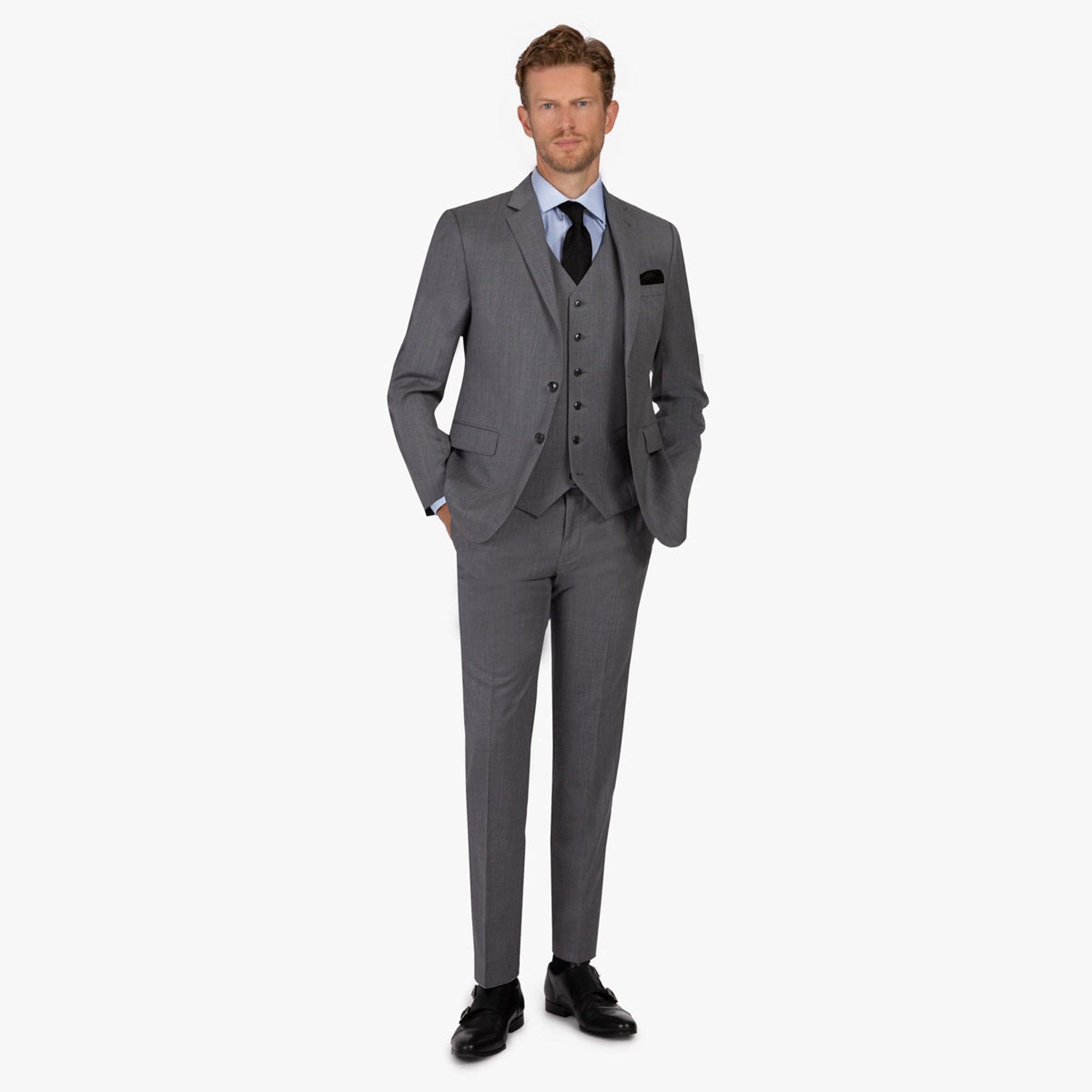 Mann im eleganten grauen Anzug.