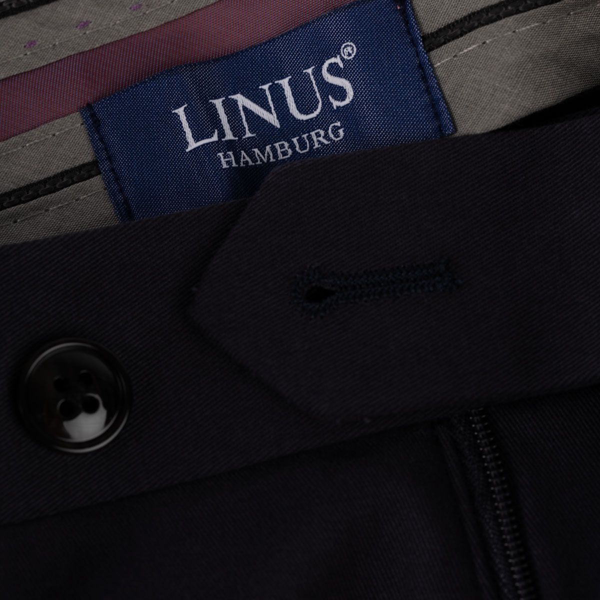 Knopf und Etikett von LINUS.