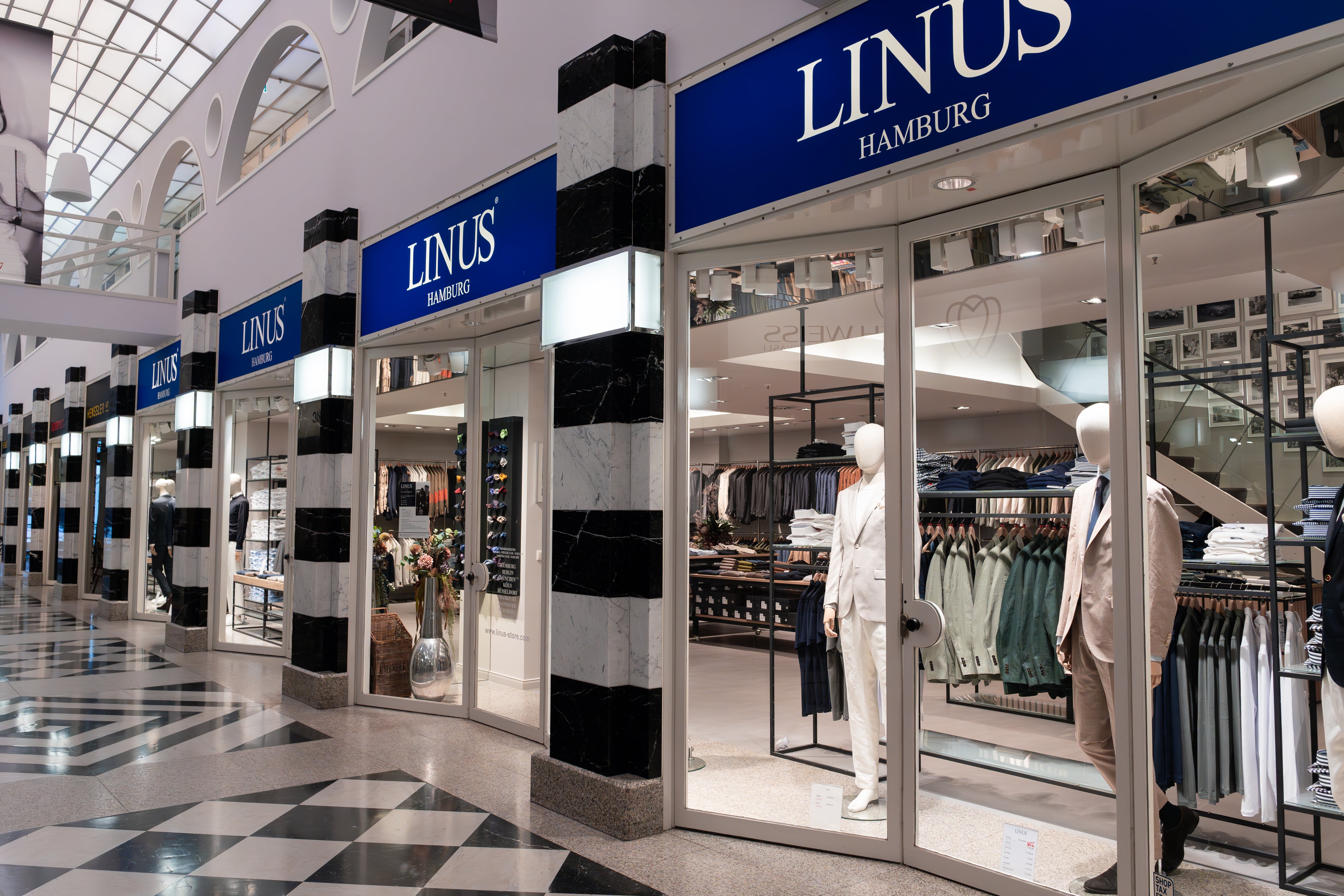 LINUS Herrenmode-Geschäft mit Anzügen.